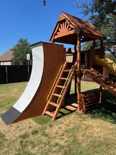 Side view of the same customer-built backyard wall and access ladder